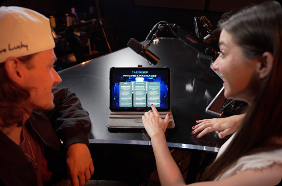 image of two people looking at the transcend podcast studio membership packages